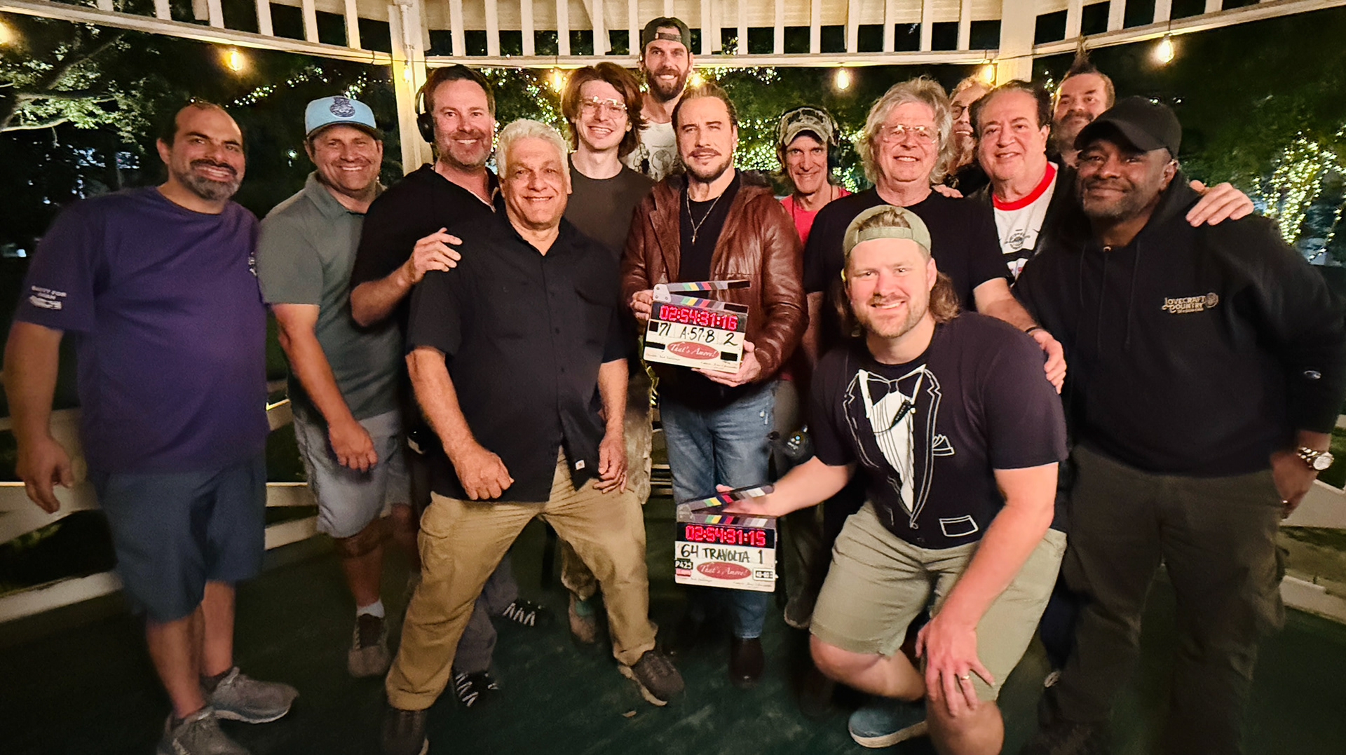 Cast and crew gathered on a production set